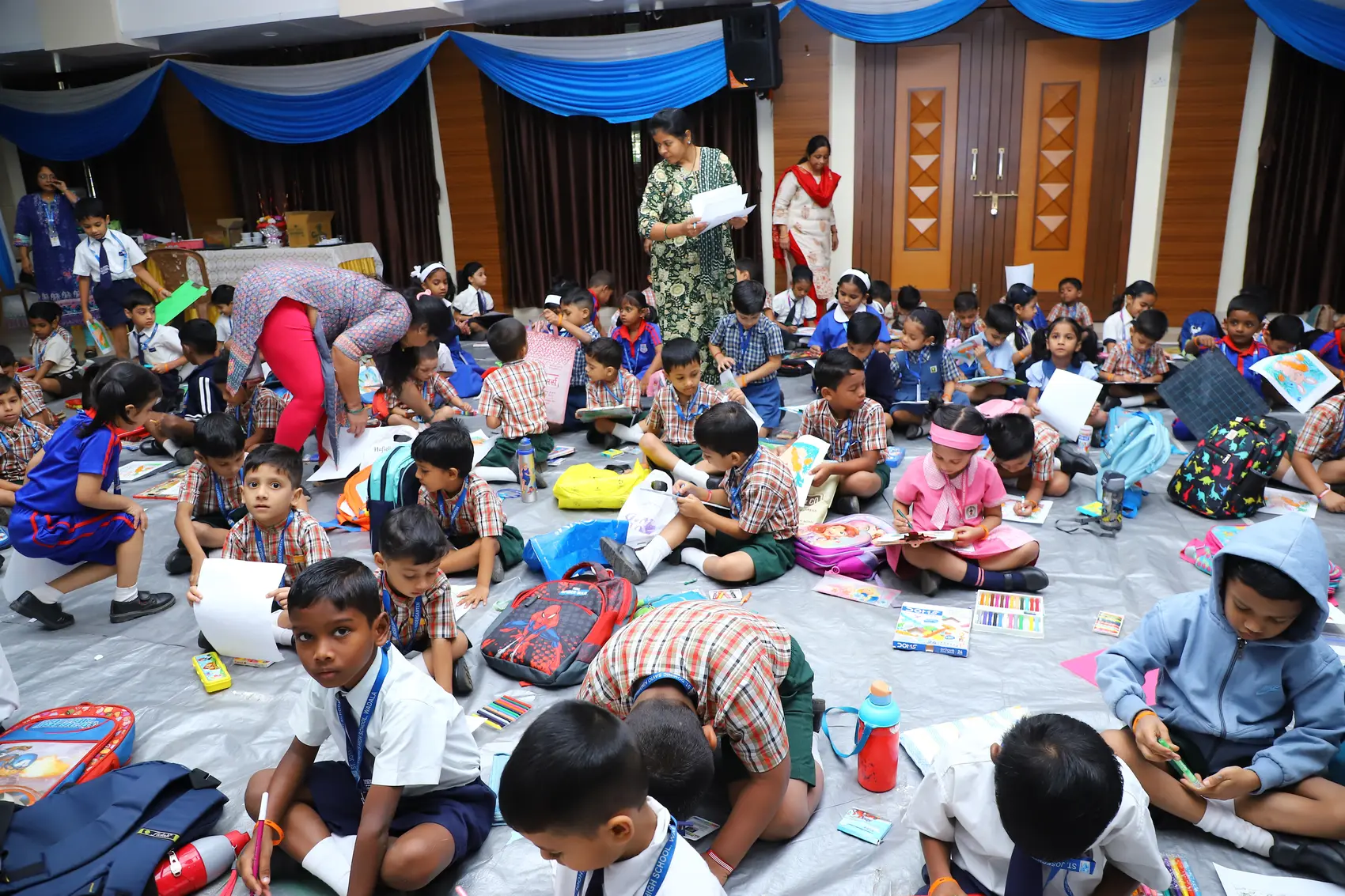 Young students participating in a colourful art competition